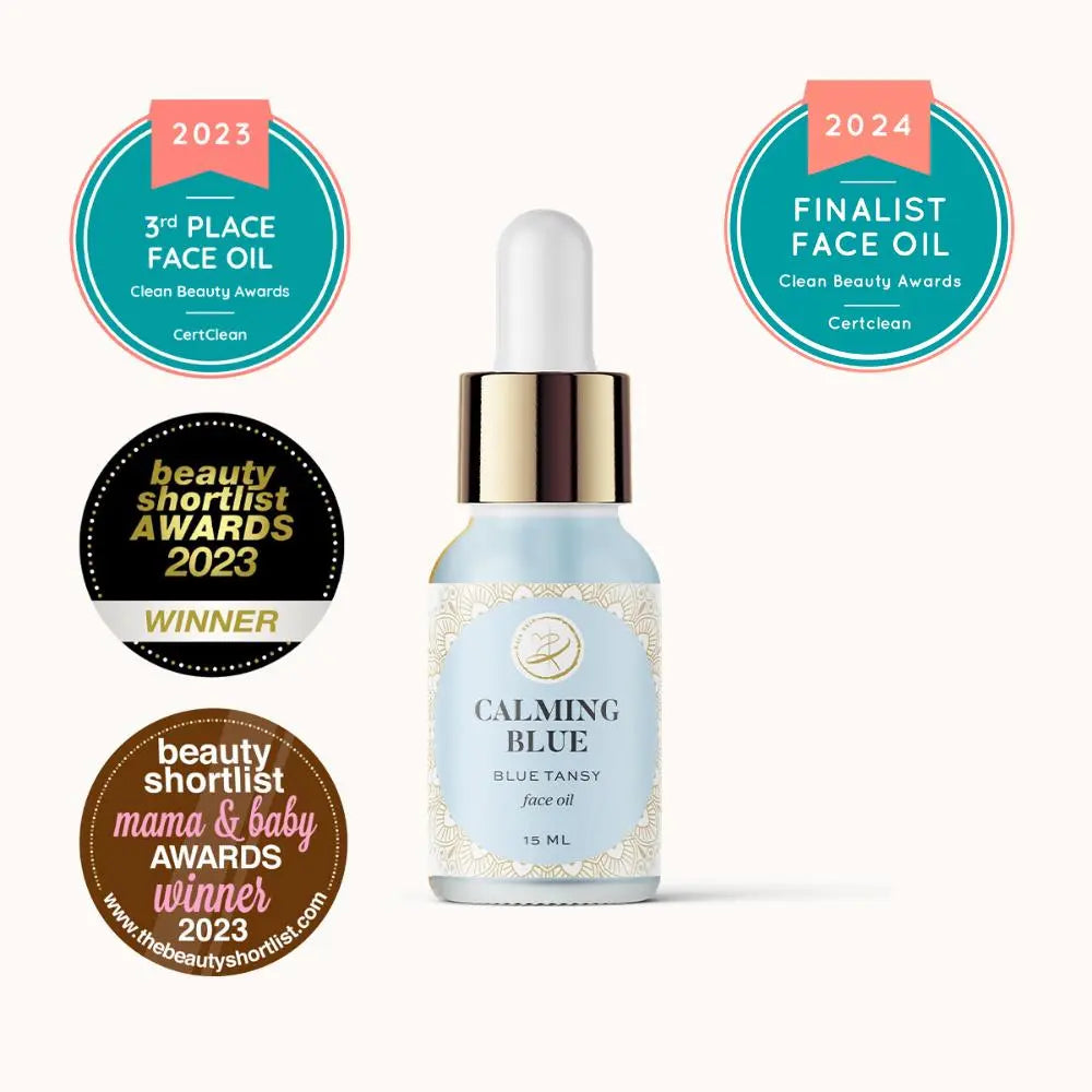 Kaia Skin Calming Blue Face Oil with Blue Tansy, Jasmine flowers, and olive squalane in a serene ritual setting