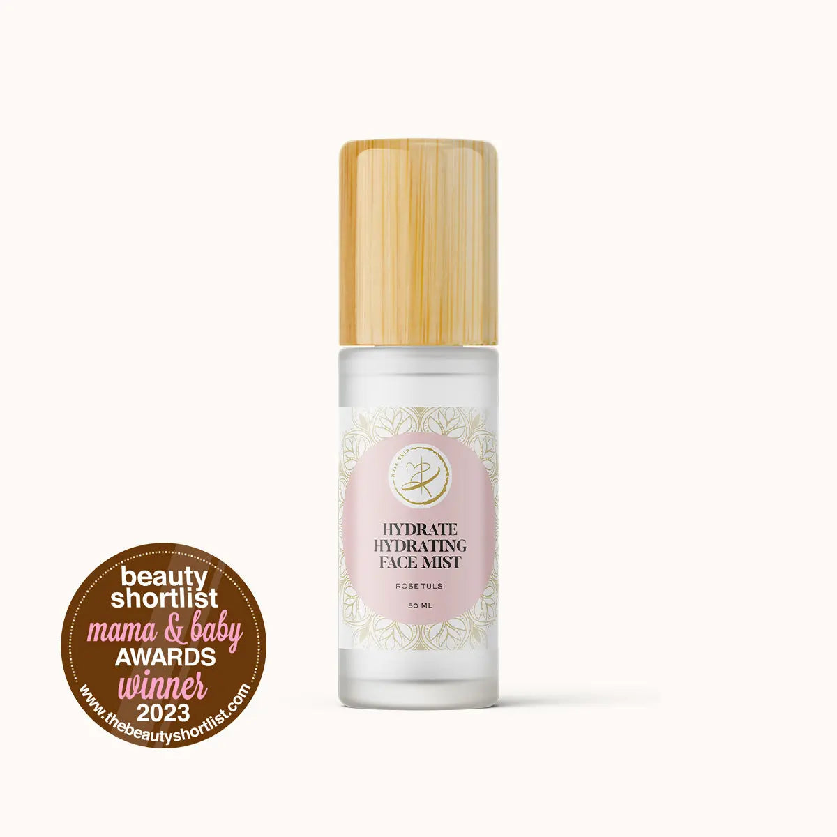 Kaia Skin Rose Tulsi Hydrate hydrosol mist with fresh rose petals and tulsi leaves in a ritual setting