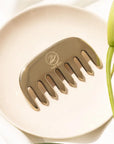 Kaia Skin Kansa Comb with Ayurvedic Intensive Hair Drops in a serene scalp-massage ritual setup