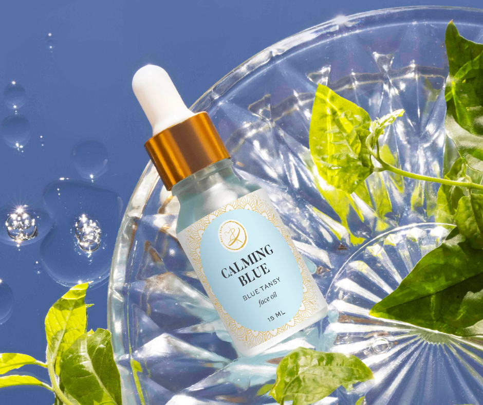 Kaia Skin Calming Blue Face Oil with Blue Tansy, Jasmine flowers, and olive squalane in a serene ritual setting