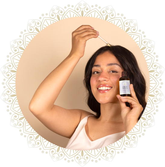 woman applying hair oil