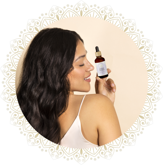 woman showcasing hair oil